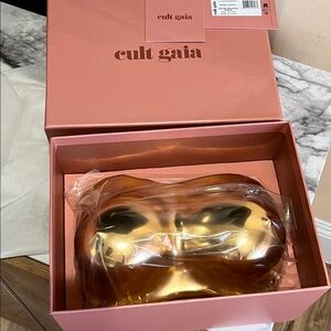 Cult Gaia metallic gold sculptural lucite Reina clutch.